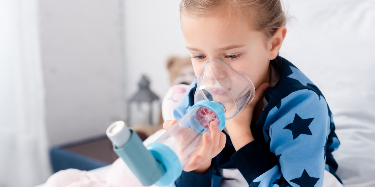 Illustration of a person using an inhaler with a spacer